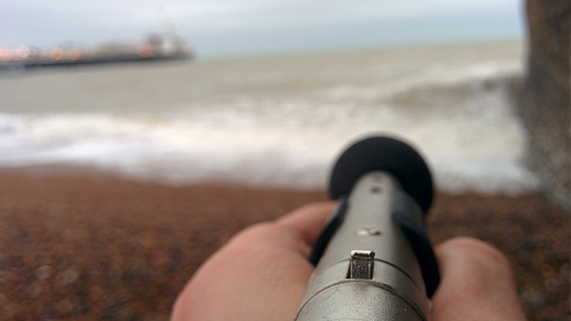 Condenser microphone aimed at the waves on Brighton beach