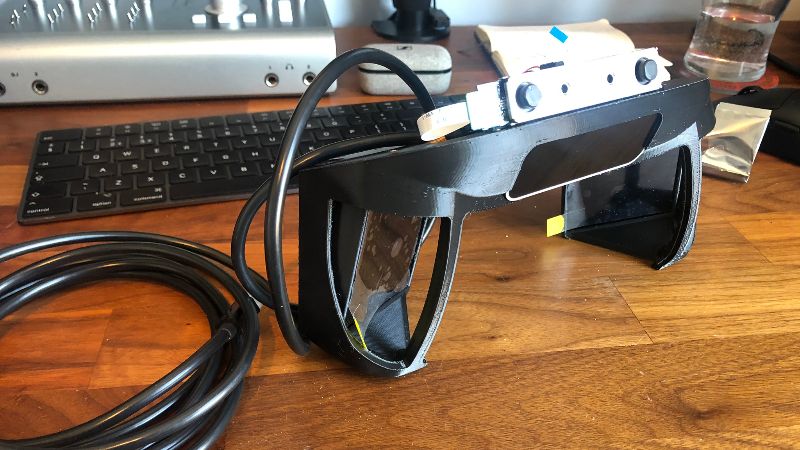 Part-assembled North Star headset optics bracket with Leap Motion Controller, and Intel Realsense T261